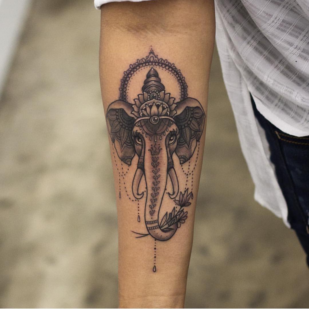 Black Ink Traditional Crown On Elephant Head Tattoo On Forearm