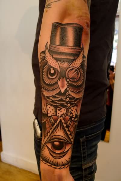 Black Ink Triangle Eye With Owl Tattoo On Left Arm
