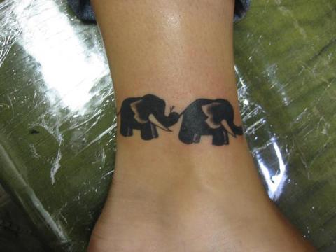 Black Ink Two Elephants Tattoo On Leg