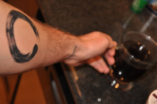 Black Ink Zen Circle Tattoo On Left Forearm