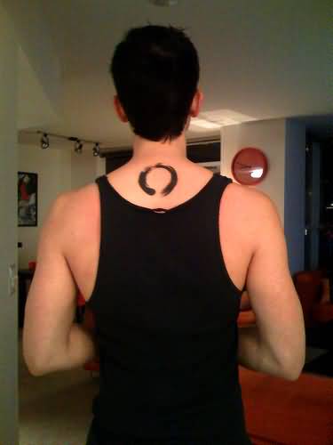 Black Ink Zen Circle Tattoo On Man Upper Back