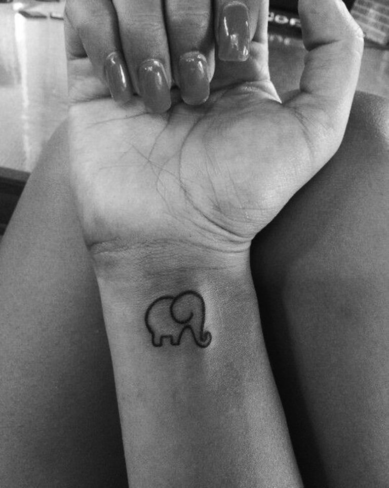 Black Outline Asian Baby Elephant Tattoo On Girl Right Wrist