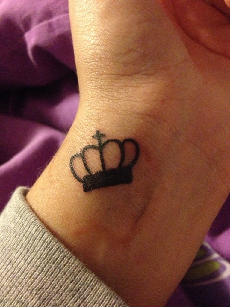 Black Outline Crown Tattoo On Left Wrist