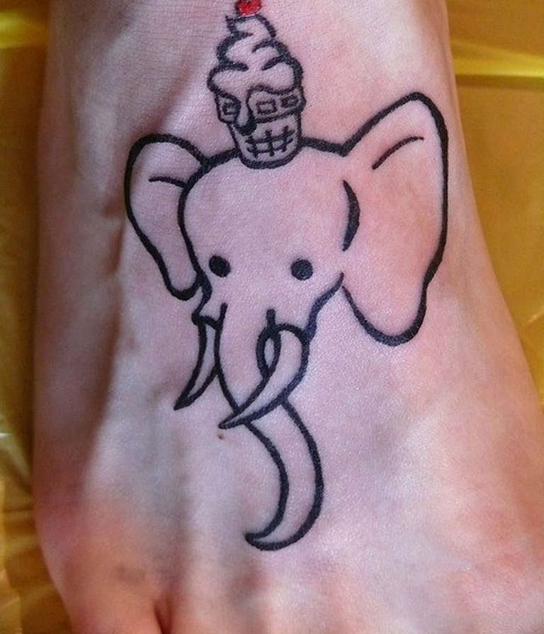 Black Outline Cupcake On Elephant Head Tattoo On Foot