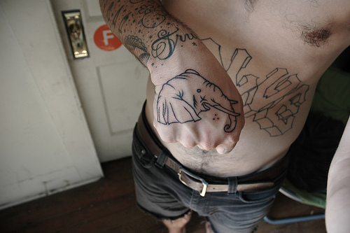 Black Outline Elephant Head Tattoo On Right Hand