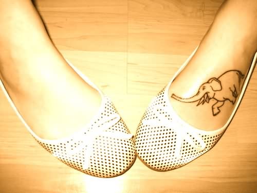 Black Outline Elephant Tattoo On Girl Left Foot