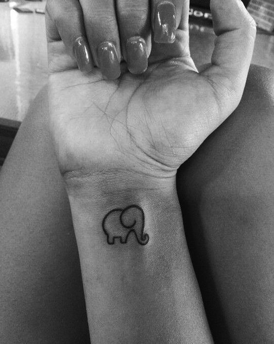 Black Outline Elephant Tattoo On Girl Right Wrist