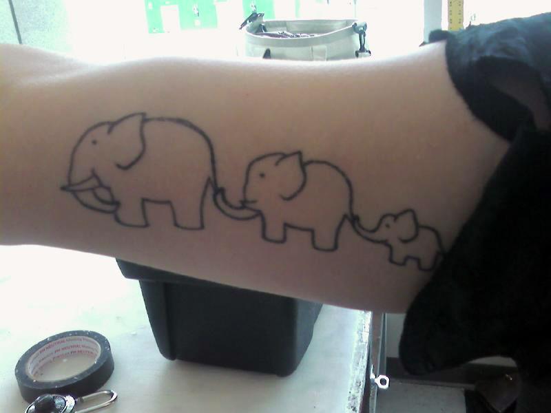 Black Outline Three Elephants Tattoo On Bicep