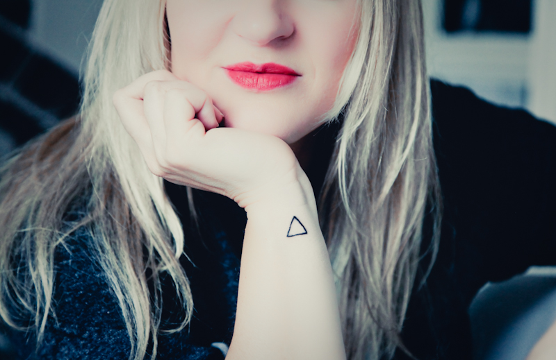 Black Outline Triangle Tattoo On Girl Right Side Wrist