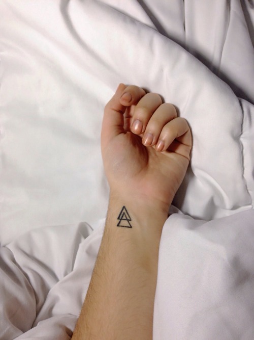 Black Outline Two Triangle Tattoo On Wrist