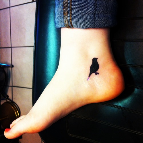 Black Silhouette Bird Ankle Tattoo