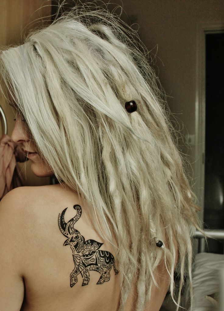 Black Tribal Chinese Elephant Trunk Up Tattoo On Girl Left Back Shoulder