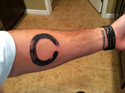 Black Zen Circle Tattoo On Left Forearm