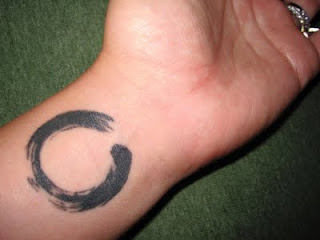 Black Zen Circle Tattoo On Left Wrist By Samuel Zerns