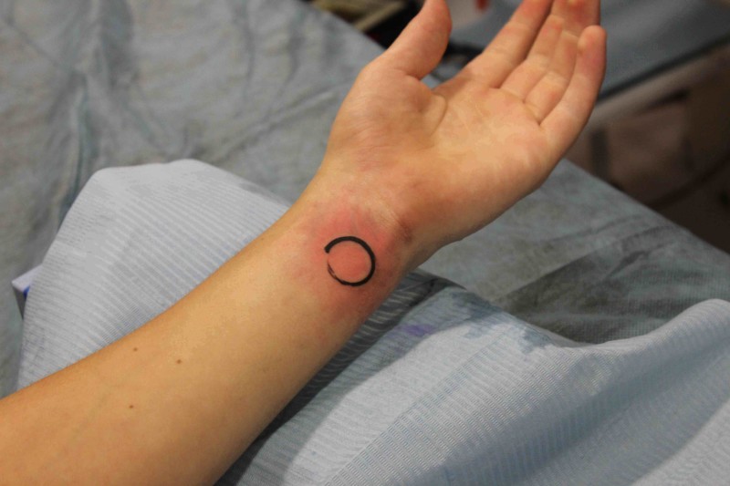 Black Zen Circle Tattoo On Left Wrist