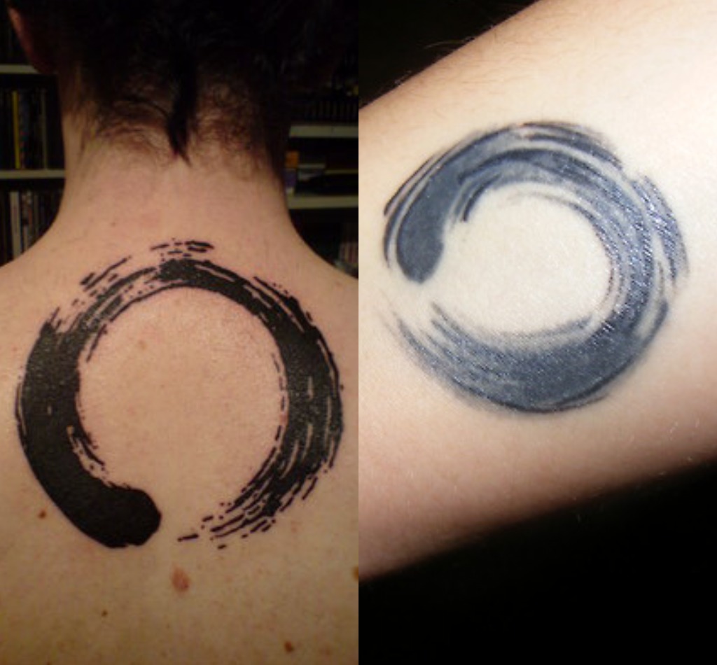 Black Zen Circle Tattoo On Upper Back