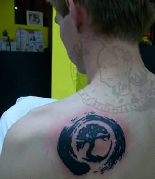 Black Zen Circle With Tree Tattoo On Left Back Shoulder