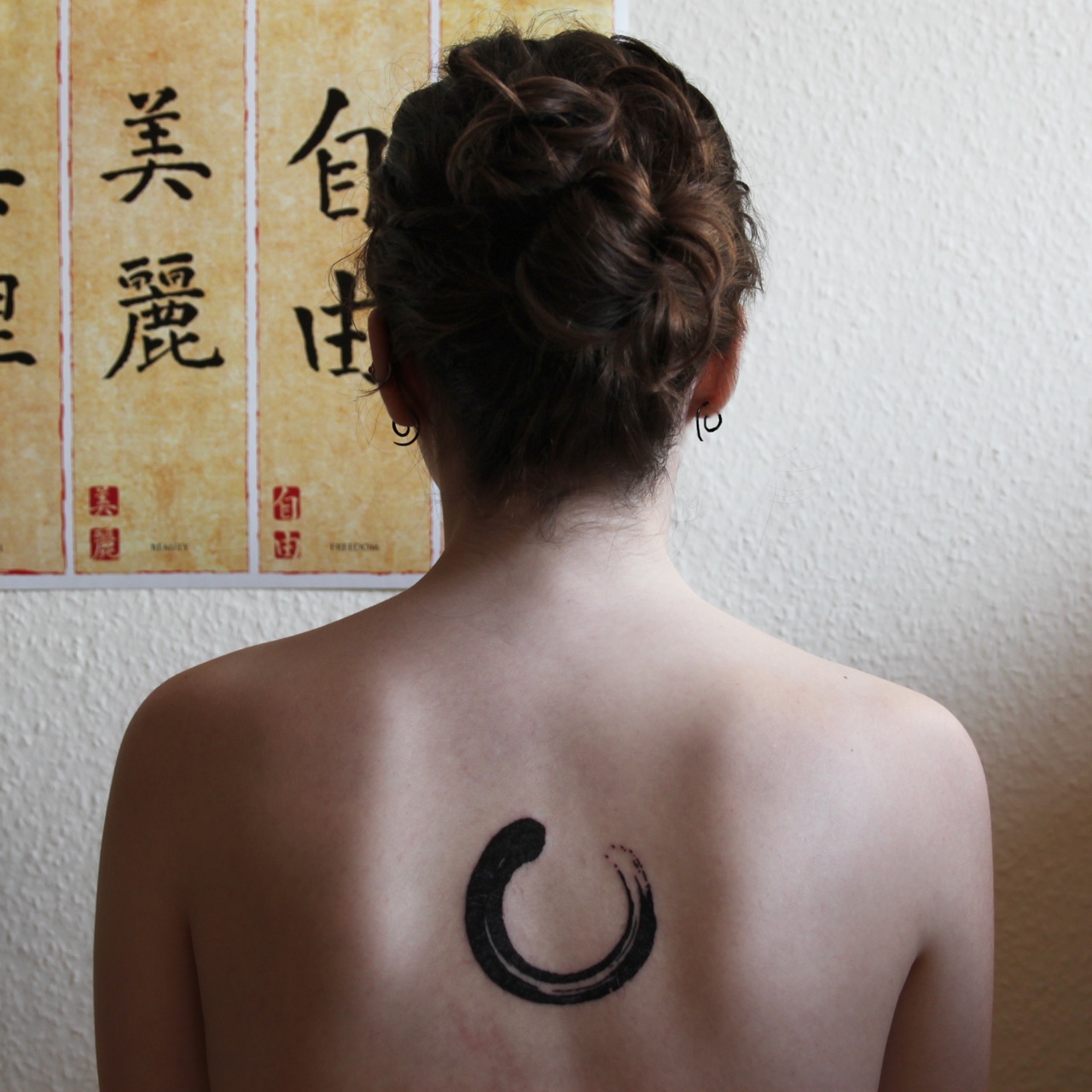 Black Zen Enso Circle Tattoo On Girl Upper Back