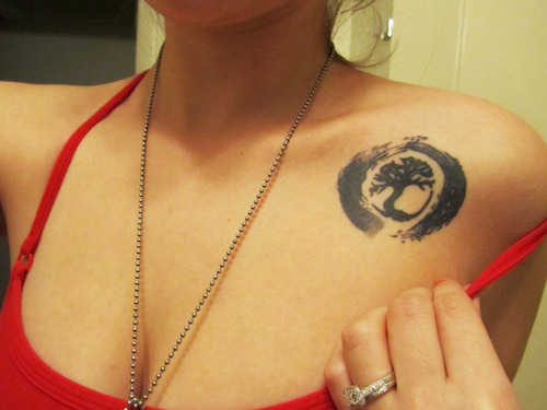 Black Zen Tree Tattoo On Girl Left Front Shoulder