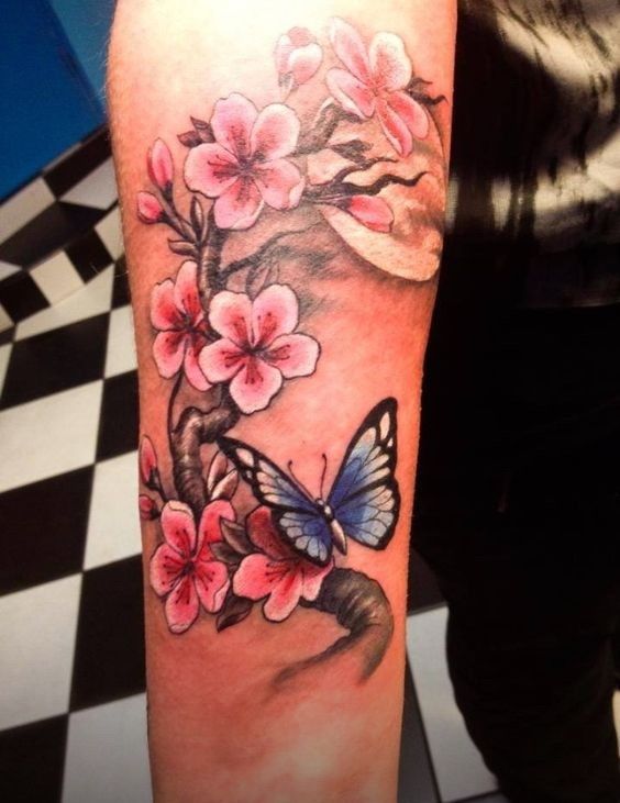 Blue Butterfly And Pink Flowers Tattoo On Sleeve