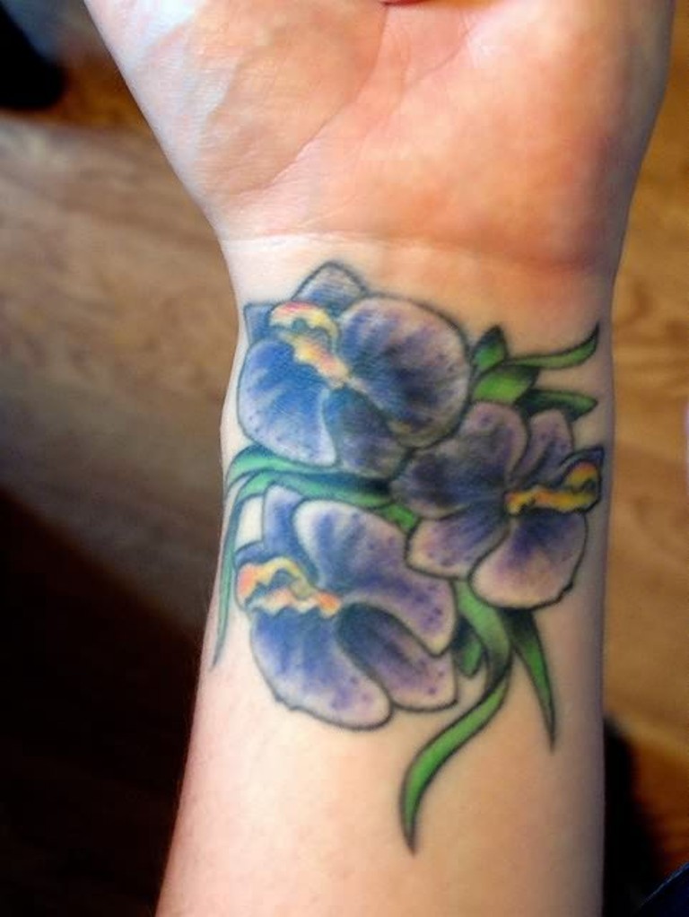 Blue Flower Tattoo On Left Wrist