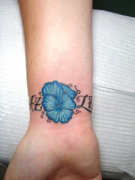 Blue Flowers Right Wrist Tattoo