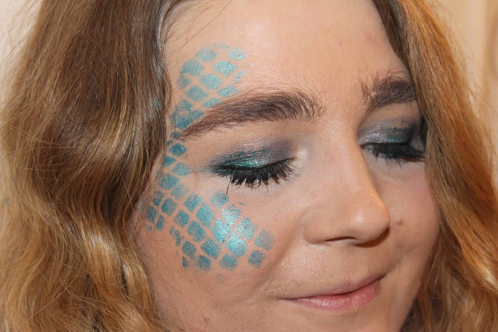 Blue Mermaid Scale Tattoo On Girl Face