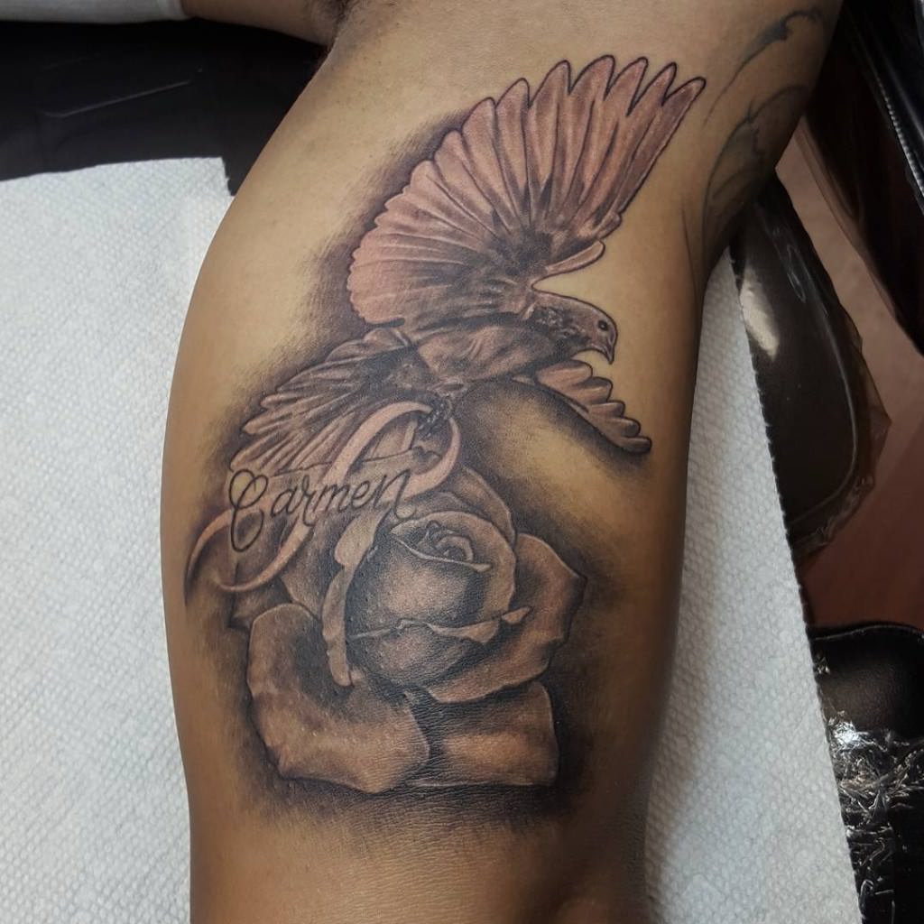 Carmen Rose And Flying Dove Tattoo On Bicep