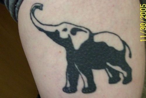 Classic Black Elephant Trunk Up Tattoo Design For Thigh