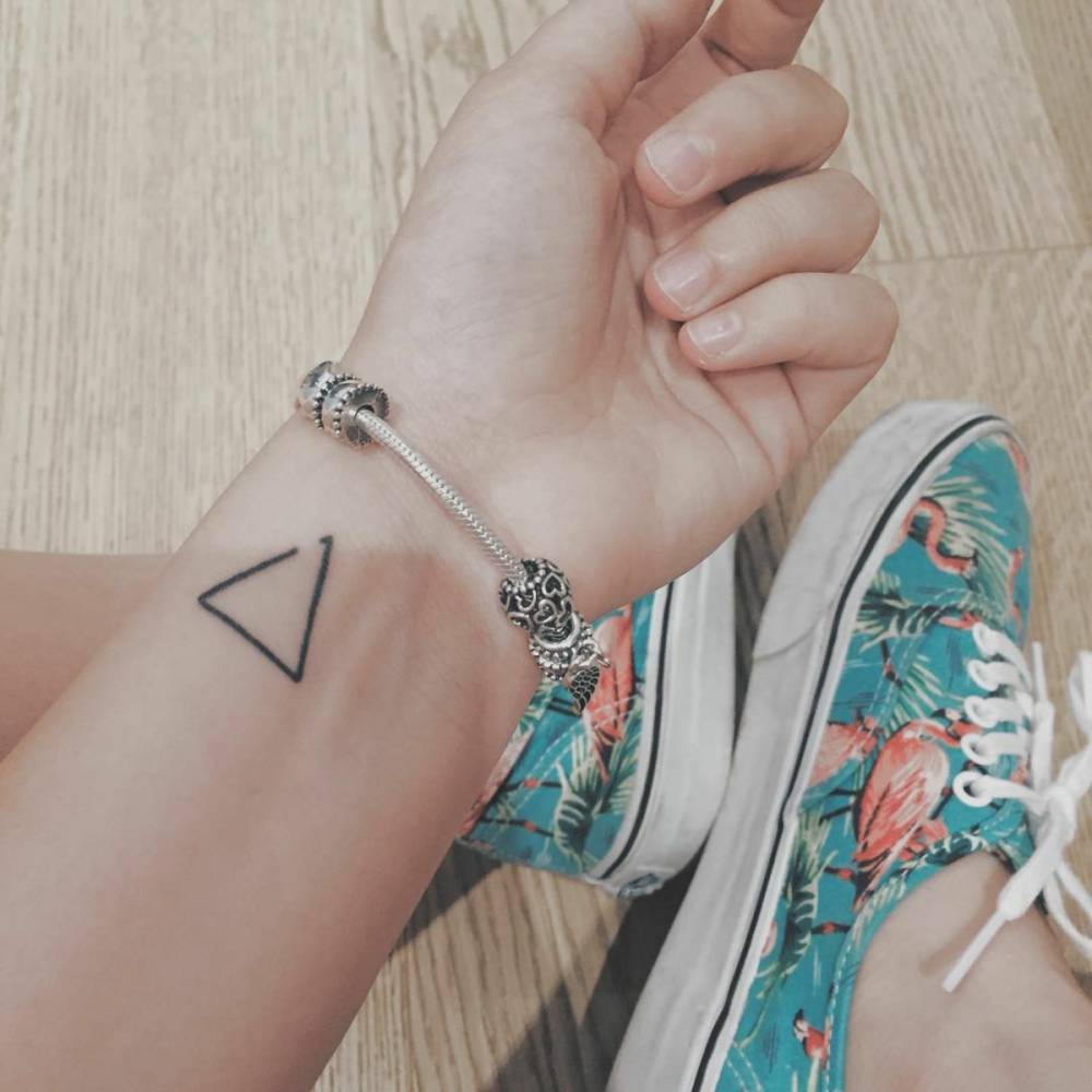 Classic Black Outline Triangle Tattoo On Girl Left Wrist