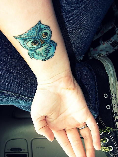 Colored Baby Owl Tattoo On Wrist For Girls