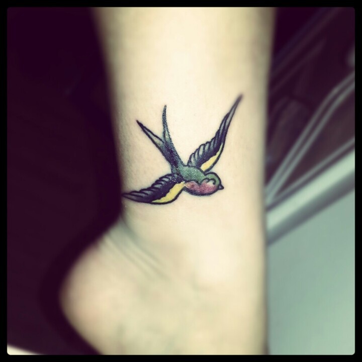 Colored Flying Bird Ankle Tattoo
