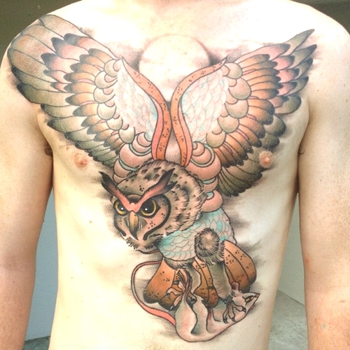 Colored Flying Owl Tattoo On Chest For Men