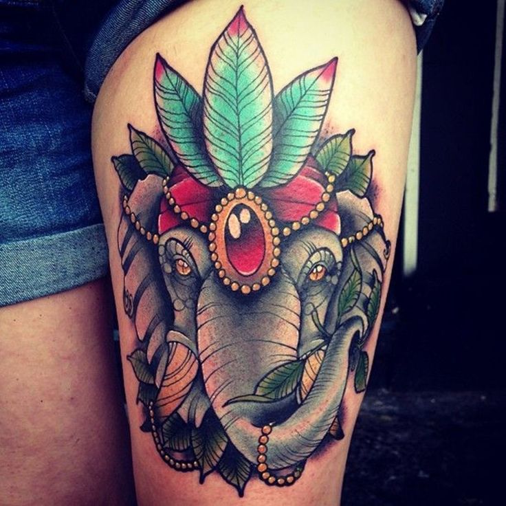 Colorful Elephant Headdress Tattoo On Girl Left Thigh