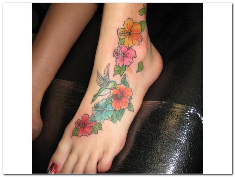 Colorful Rhododendron Flowers With Flying Bird Tattoo On Girl Left Foot