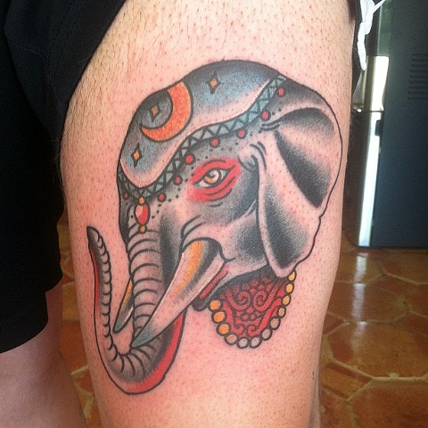 Colorful Traditional Elephant Head Tattoo On Left Thigh