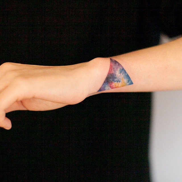 Colorful Triangle Tattoo On Left Side Wrist