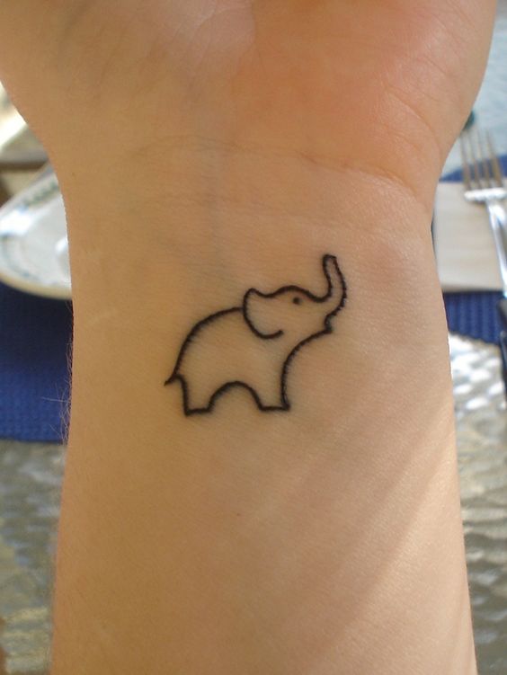 Cool Black Outline Elephant Trunk Up Tattoo On Wrist