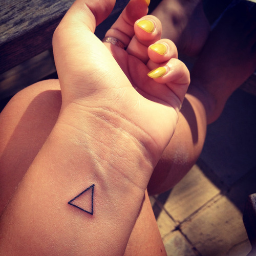 Cool Black Outline Triangle Tattoo On Girl Left Wrist