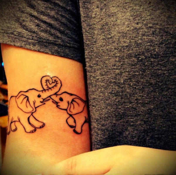 Cool Black Outline Two Elephants Tattoo On Bicep