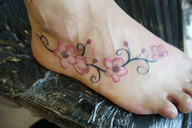 Cool Cherry Blossom Tattoo On Girl Right Foot