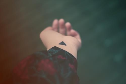 Cool Silhouette Triangle Tattoo On Left Wrist
