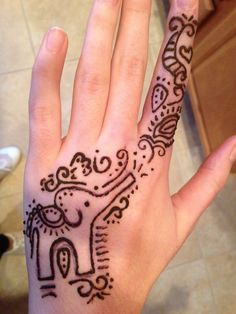 Cute Henna Elephant Trunk Up Tattoo On Left Hand