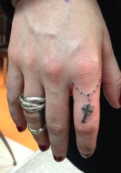Cute Small Rosary Cross Tattoo On Finger
