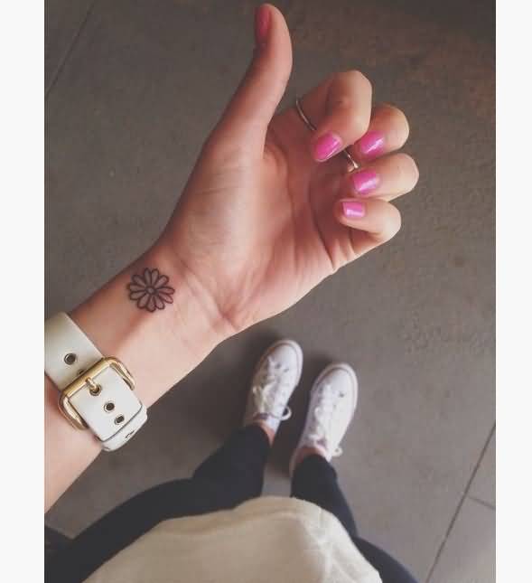 Daisy Flower Tattoo On Girl Left Wrist