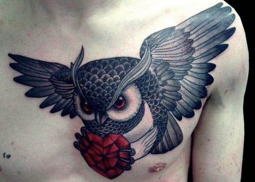 Diamond Heart In Flying Owl Claws Tattoo On Chest