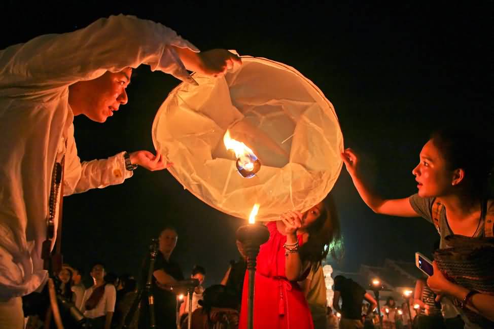 Family Releasing Lantern During Yi Peng Festival