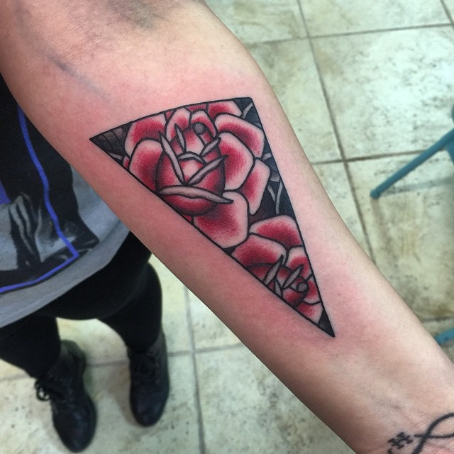 Flowers In Triangle Tattoo On Left Forearm