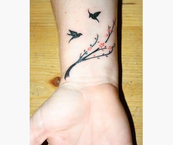 Flying Birds And Flower Tattoo On Wrist
