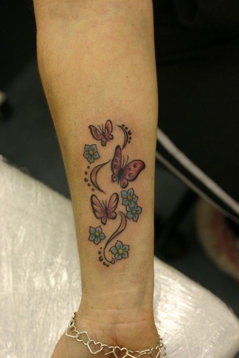 Flying Butterflies And Blue Flowers Wrist Tattoo